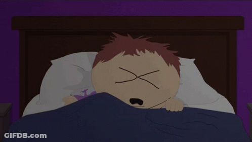A Cartoon Character Laying In Bed With His Eyes Crossed GIF