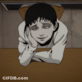 A Cartoon Character Laying On A Table With His Head On His Hand GIF