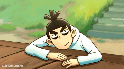 A Cartoon Character Laying On A Wooden Surface GIF