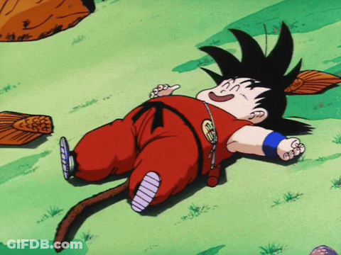 A Cartoon Character Laying On The Ground With A Tail And A Necklace That Says ' Goku ' On It GIF