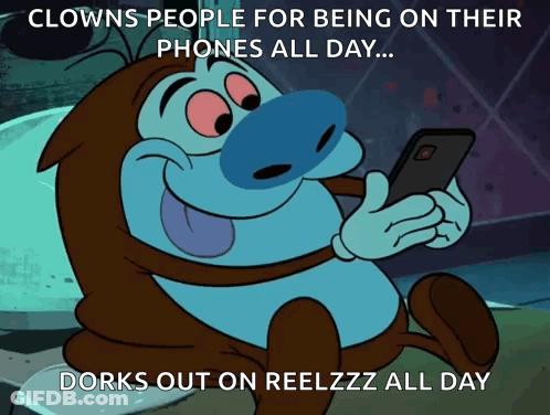 A Cartoon Character Looking At A Cell Phone With A Caption That Says Clowns People For Being On Their Phones All Day ... GIF