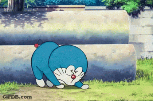 A Cartoon Character Named Doraemon With A Red Nose GIF