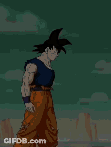 A Cartoon Character Named Goku From Dragon Ball Is Standing In Front Of A Mountain GIF