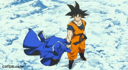 A Cartoon Character Named Goku Is Standing In The Snow Holding A Blue Coat GIF