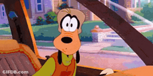 A Cartoon Character Named Goofy Is Sitting In The Driver 'S Seat Of A Car GIF