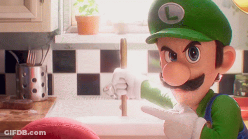 A Cartoon Character Named Luigi Is Pointing At Something In A Kitchen GIF