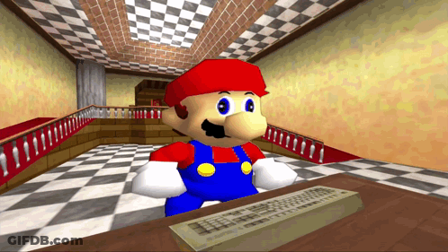 A Cartoon Character Named Mario Is Sitting At A Desk With A Keyboard GIF