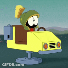 A Cartoon Character Named Marvin The Martian Is Driving A Yellow Car GIF