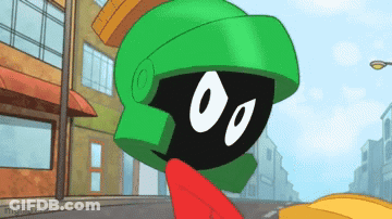 A Cartoon Character Named Marvin The Martian Is Standing In Front Of A Building GIF