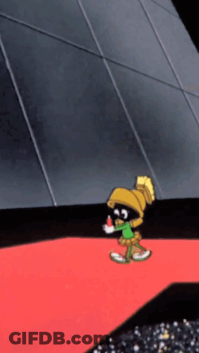 A Cartoon Character Named Marvin The Martian Is Standing On A Red Carpet GIF
