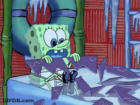 A Cartoon Character Named Spongebob Is Sitting On A Table Holding A Piece Of Ice . GIF