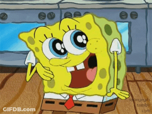 A Cartoon Character Named Spongebob Is Sitting On A Wooden Table GIF