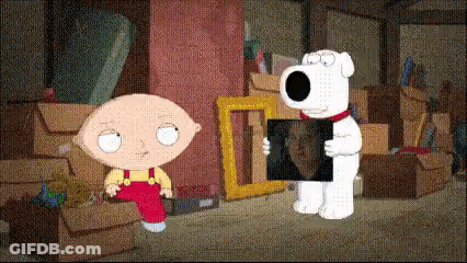 A Cartoon Character Named Stewie Holding A Picture Of Brian GIF