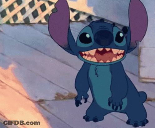 A Cartoon Character Named Stitch Is Smiling And Standing On A Wooden Floor GIF