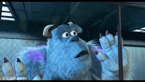 A Cartoon Character Named Sulley Is Behind A Fence GIF