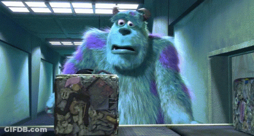 A Cartoon Character Named Sulley Is Standing In A Hallway Looking At A Box GIF