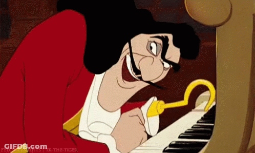 A Cartoon Character Playing A Piano With A Hook In His Mouth GIF