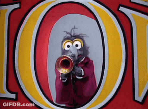 A Cartoon Character Playing A Trumpet In Front Of A Large Letter O GIF
