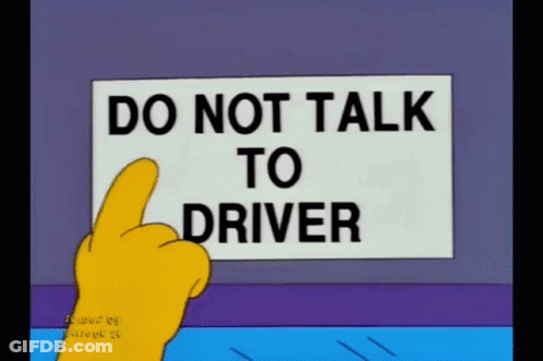 A Cartoon Character Points To A Sign That Says " Do Not Talk To Driver " GIF