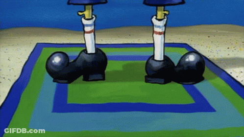 A Cartoon Character 'S Feet Are Standing On A Rug GIF