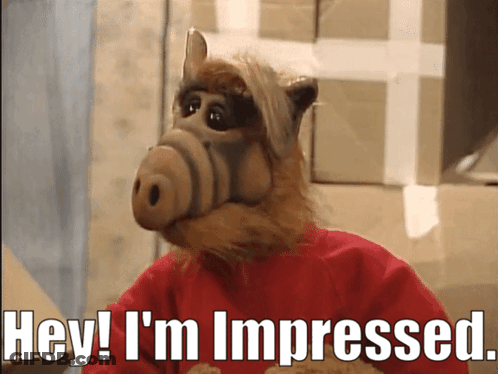 A Cartoon Character Says Hey I 'M Impressed While Wearing A Red Sweater GIF