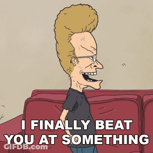 A Cartoon Character Says " I Finally Beat You At Something " While Standing Next To A Red Couch GIF