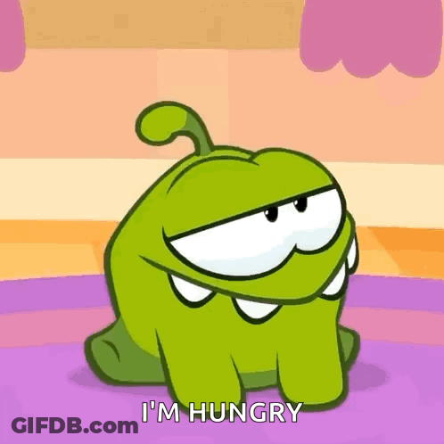A Cartoon Character Says I 'M Hungry While Sitting On The Floor . GIF