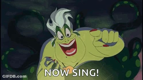 A Cartoon Character Says " Now Sing " In A Dark Background GIF