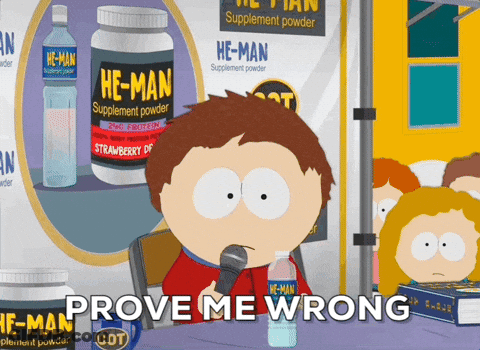 A Cartoon Character Says Prove Me Wrong While Holding A Microphone In Front Of A Bottle Of He-Man Supplement Powder GIF