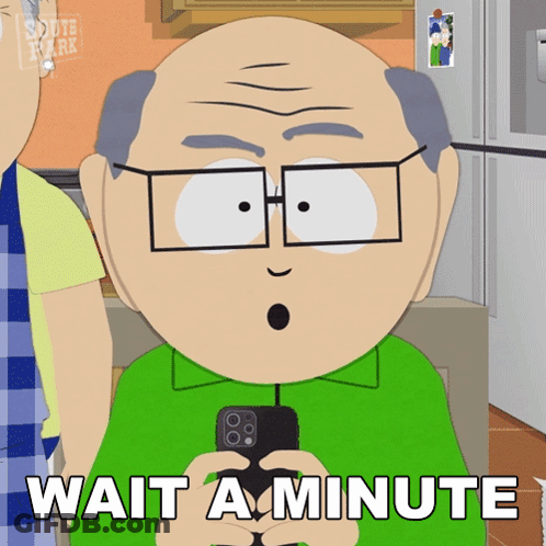 A Cartoon Character Says Wait A Minute While Holding A Phone GIF