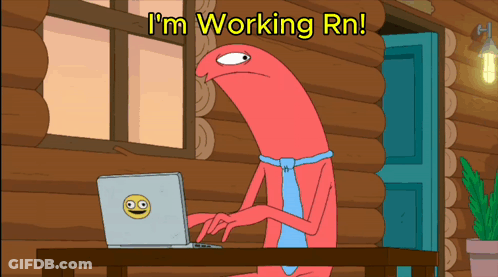 A Cartoon Character Sitting At A Desk With A Laptop And The Words I 'M Working Rn GIF
