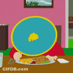 A Cartoon Character Sitting At A Table With A Plate Of Food In Front Of Him GIF