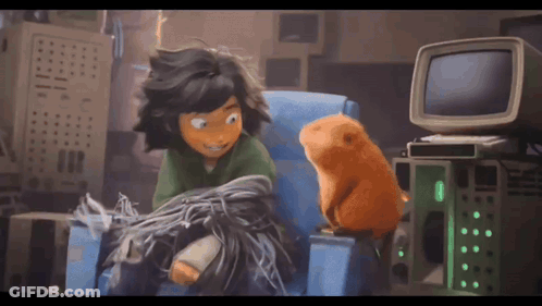 A Cartoon Character Sitting In A Chair With A Hamster GIF