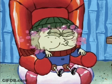 A Cartoon Character Sitting In A Chair With Bubbles Coming Out Of His Eyes GIF