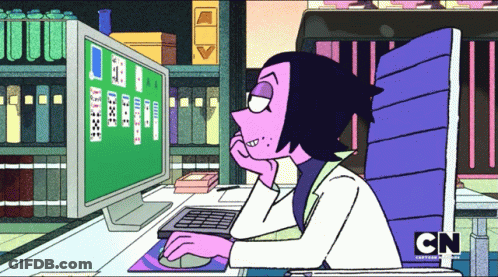 A Cartoon Character Sitting In Front Of A Computer With Cn Written On The Bottom Of The Screen GIF