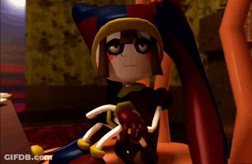 A Cartoon Character Sitting On A Chair With A Red And Yellow Hat GIF