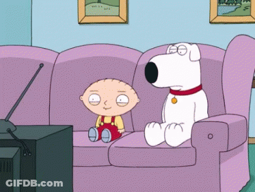 A Cartoon Character Sitting On A Couch Next To A White Dog GIF