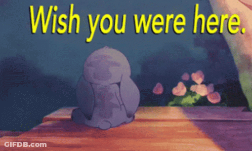 A Cartoon Character Sitting On A Wooden Ledge With The Words Wish You Were Here Above Him GIF