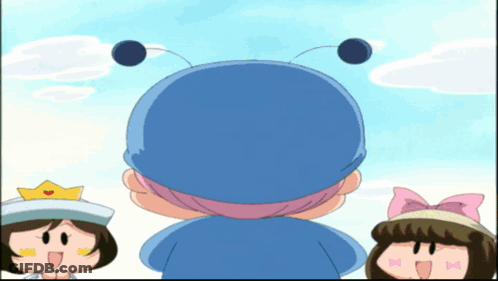 A Cartoon Character Wearing A Blue Hat And A Pink Bow GIF
