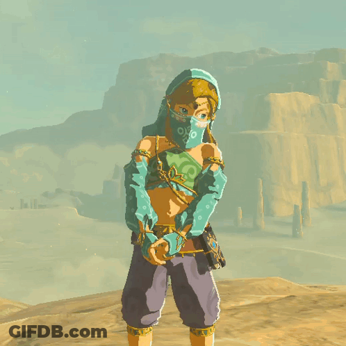 A Cartoon Character Wearing A Blue Hooded Top And Purple Pants Stands In A Desert GIF