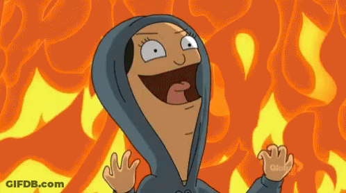 A Cartoon Character Wearing A Blue Hoodie Is Standing In Front Of A Fire Background . GIF