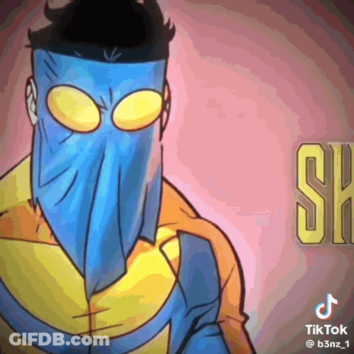 A Cartoon Character Wearing A Blue Mask And A Yellow Jacket . GIF
