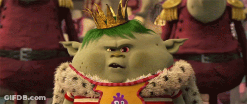 A Cartoon Character Wearing A Crown And A Shirt That Says ' King ' On It GIF