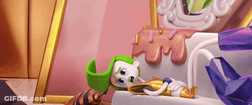 A Cartoon Character Wearing A Green Hat Is Laying On A Couch . GIF
