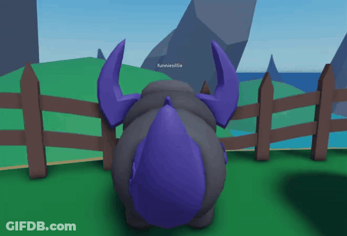 A Cartoon Character Wearing A Purple Scarf And Wings Is Sticking Its Tongue Out GIF