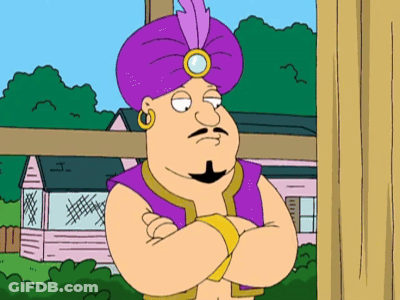 A Cartoon Character Wearing A Purple Turban Stands With His Arms Crossed In Front Of A House GIF