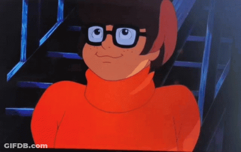 A Cartoon Character Wearing A Red Turtleneck And Glasses GIF