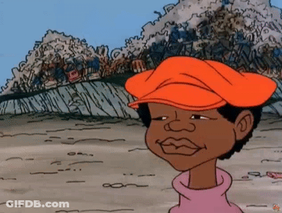 A Cartoon Character Wearing An Orange Hat Is Standing In Front Of A Pile Of Trash . GIF