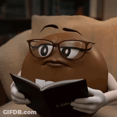 A Cartoon Character Wearing Glasses Is Reading A Book Called C-Suite GIF