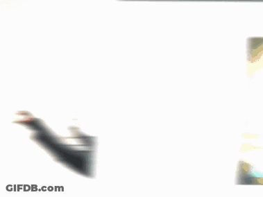 A Cartoon Character Wearing Headphones And Sunglasses Is Standing Next To A White Wall . GIF